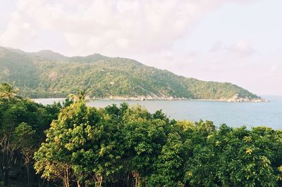 Scenic view of calm sea against cloudy sky