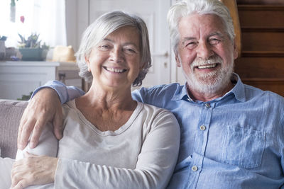 Portrait of smiling friends at home