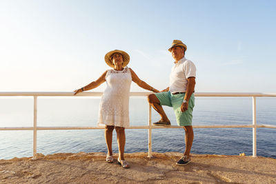 Senior couple at viewpoint at the coast, el roc de sant gaieta, spain