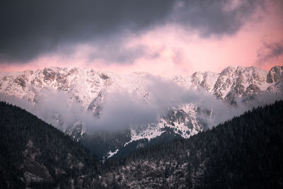 Scenic view of dramatic sky during winter