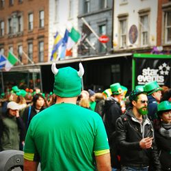 People in leprechaun costume on street during st patricks day