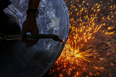 Low angle view of fireworks against sky