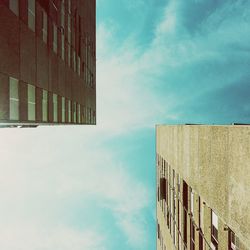 Low angle view of building against cloudy sky