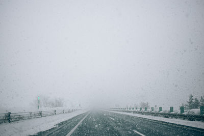 Road against sky during winter