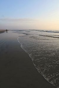 Scenic view of sea against clear sky during sunset