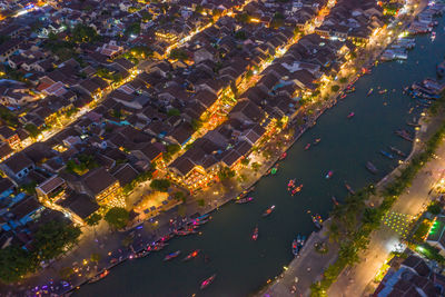 High angle view of illuminated buildings in city at night