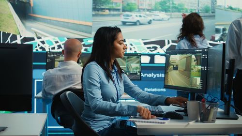 Rear view of woman working in office