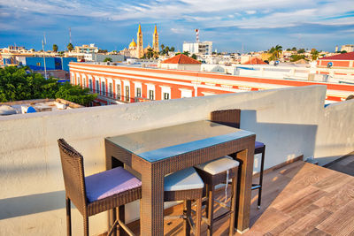 High angle view of tables and chairs in building