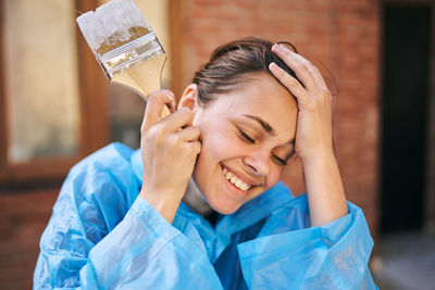 Cropped hand of woman using mobile phone