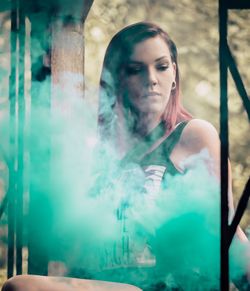 Portrait of young woman looking down