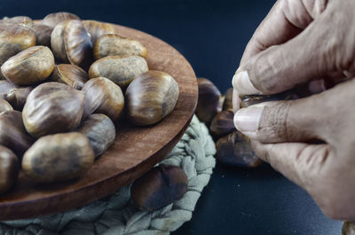 Close-up of person preparing food on table