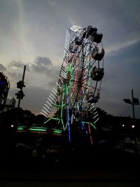 Low angle view of ferris wheel against sky