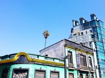 Low angle view of building against blue sky