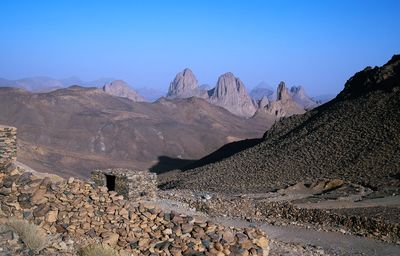 Scenic view of mountains against clear blue sky