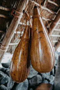 Close-up of container handing in hut