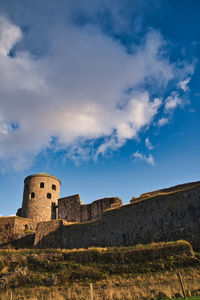 Low angle view of fort against sky