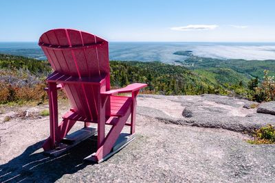 Empty chairs on beach