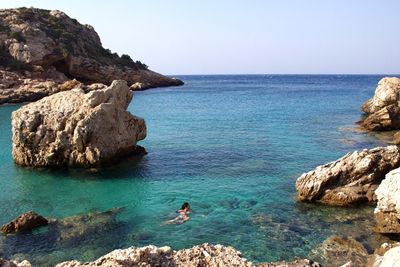 High angle view of woman swimming in sea at beach