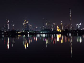 Reflection of buildings in city at night