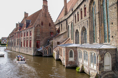 Arch bridge over river in city