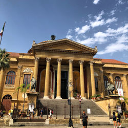 Group of people in front of historical building