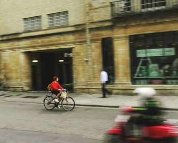 Man riding bicycle in city