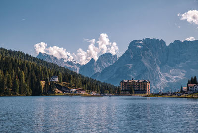 Scenic view of lake and mountains against sky