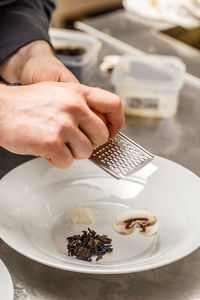 Midsection of man preparing food