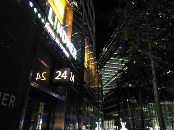 Low angle view of illuminated city at night