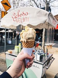 Hand holding ice cream