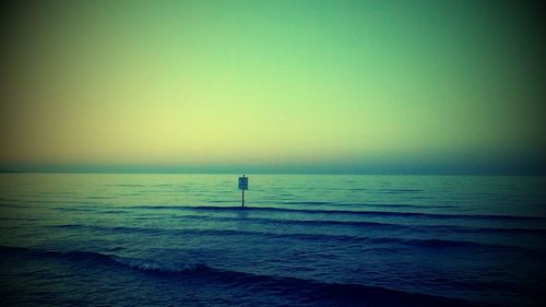 Scenic view of sea at sunset