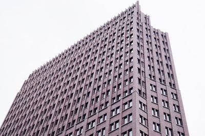 Low angle view of office building against sky