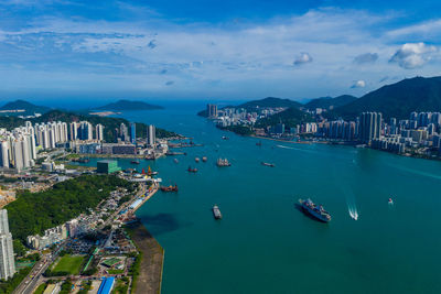 High angle view of bay and buildings against sky