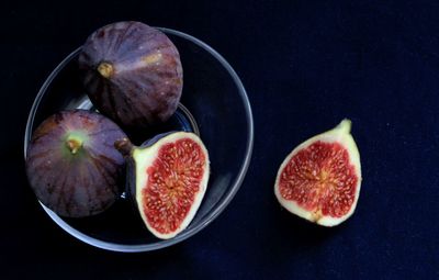 High angle view of fruits on table against black background