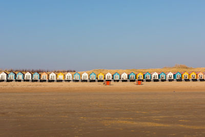 Row of beach against clear sky