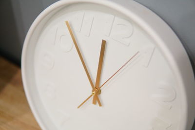 Close-up of clock on table