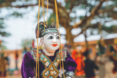 Close-up of carousel hanging in amusement park