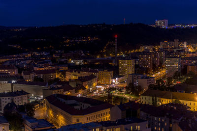 High angle view of illuminated city buildings at night