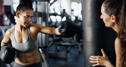 Female boxer practicing at gym