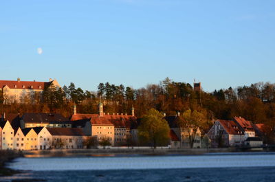 Houses in town against clear sky