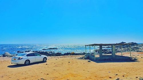 Scenic view of sea against clear blue sky