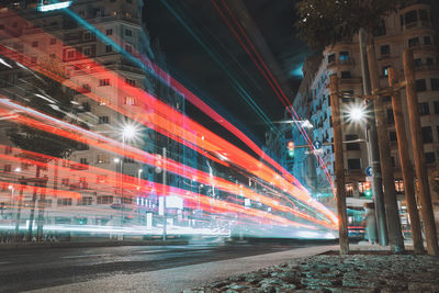 High angle view of light trails on road at night