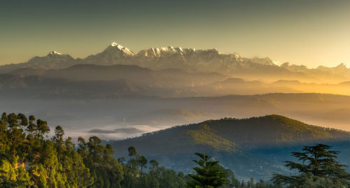 Scenic view of mountains against sky during sunset