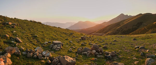 Scenic view of mountains against sky during sunset