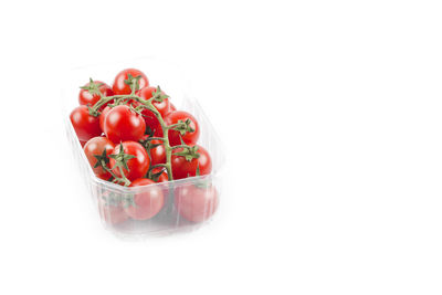 Close-up of strawberries in bowl against white background