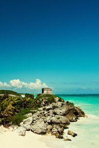 Scenic view of sea against blue sky