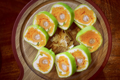 High angle view of fruits in plate on table