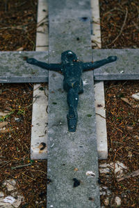 High angle view of cross on metal