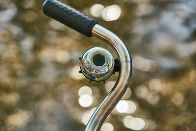 Close-up of bicycle wheel against blurred background