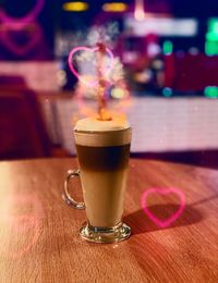 Close-up of coffee served on table at cafe